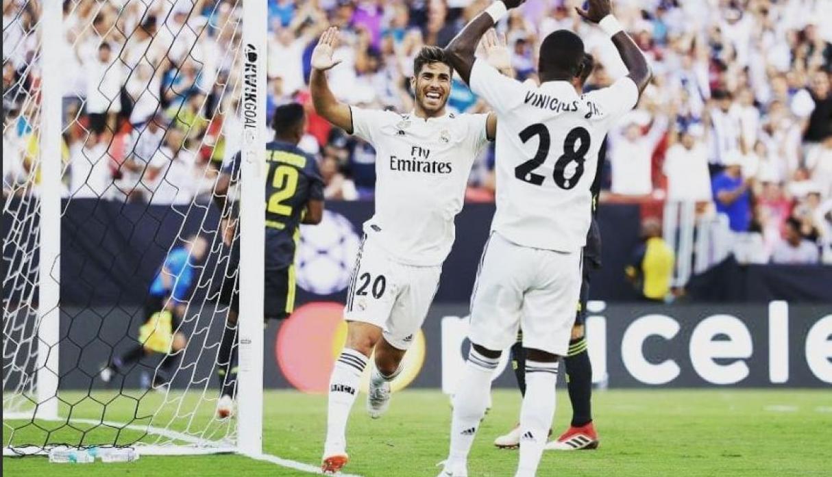 Marco Asensio con Vinicius